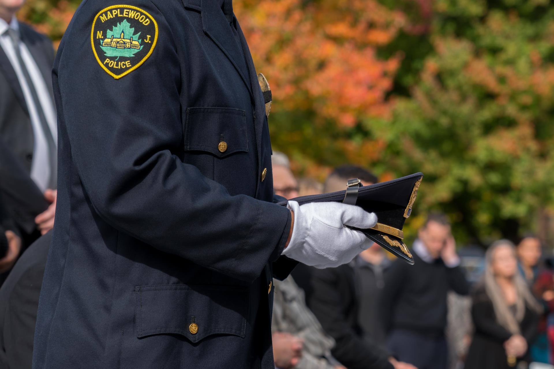 Close-up image of Chief Sally carrying Chief DeVaul's cap.